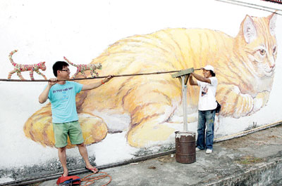 大马槟岛华人古迹区现大猫壁画 成拍照新热点