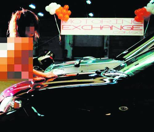 任半裸洗车女模 新加坡中国女学生被开除(组图