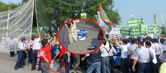 马英九遭民众丢拖鞋抗议警察拉网防护（图）