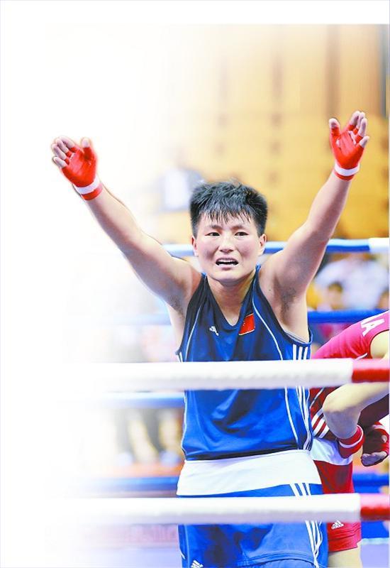 女拳强人猛冲猛打首获金 悬殊比分战胜对手