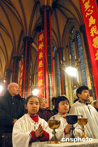 图北京天主教信众参加圣诞弥撒
